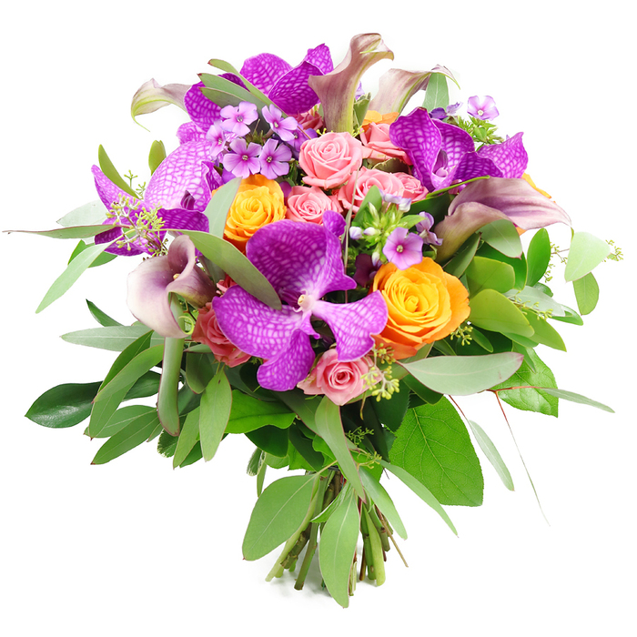 A richly detailed floral bouquet is captured against a pure white background, highlighting every nuance of its colour story and craftsmanship. The design is dominated by several show-stopping Vanda orchids in jewel-toned fuchsia-purple, each bloom featuring an intricate, net-like pattern of lighter speckles that gives them a refined, almost couture quality. Surrounding these orchids are exuberant clusters of orange roses, their petals densely layered in tight spirals that read as energetic and joyful, like small suns nestled among the purples and pinks. Interlaced with them are soft pink and blush-toned roses, ranging from neatly closed buds to half-open, ruffled blossoms, bringing a tender, romantic dimension that softens the bolder hues. Rising gracefully from the centre, slim calla lilies in muted lavender and dusky plum arc upwards, their smooth, sculptural trumpets introducing elegant lines and a sense of fluid movement. The bouquet is cradled in abundant greenery: silvery-green eucalyptus leaves extend outward in slender trails, while broader, deeper green foliage provides a dense, verdant base that frames the blooms and adds depth. Sprigs of tiny lavender or light-purple filler flowers are tucked thoughtfully throughout, their star-like blossoms adding fine detail and subtle texture. At the base, the fresh stems are clearly visible and neatly tied, confirming this as a hand-tied, artisan arrangement rather than a mass-produced display. The overall effect suggests a bouquet prepared by a skilled local florist in Queensbury, perhaps in a shop just off the main high street, ready to be delivered for a milestone birthday, a heartfelt anniversary, or an elegant dinner party, where its mix of exotic orchids and classic roses would feel equally at home.