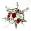 This bouquet, expertly crafted by a Queensbury florist, is a graceful symphony of colour and form. A halo of velvety crimson roses blooms at its heart, their rich shade radiating warmth and deep affection. Around them, white gerbera daisies-fresh and crisp, with deep espresso centres-interlace with clusters of dainty white spray chrysanthemums, creating a gentle interplay of boldness and softness. Sprigs of cool eucalyptus fan outward, their silvery-green leaves imparting a stylish, airy touch that feels reminiscent of a quiet morning in Roe Green Park. Hints of pale lavender lisianthus slip in between, bringing calm and subtle sophistication. This arrangement feels at once festive and soothing, thoughtfully arranged to mark the most treasured moments-be that a milestone birthday, a heartfelt thank you, or a romantic gesture delivered on a blustery afternoon in Queensbury. Lush greenery adds structure, while the careful contrast of blooms and textures creates a sense of abundant harmony. Under bright, clear light, every petal, leaf, and colourful nuance is celebrated, making this bouquet perfect for bringing local beauty and warmth into any Queensbury home.