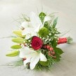 Elegant yet vibrant, this hand-tied bouquet rests gently on an off-white, subtly textured surface, inviting the viewer into a world of floral artistry cherished by the Queensbury community. White lilies, with petals unfolding gracefully and soft maroon brushstrokes at their centers, embody purity and refined beauty; nestled among them, elongated lime-green lily buds add a lively note of anticipation. The bouquet's centrepiece-a single, velvety deep red rose-commands attention, unfurling tightly and symbolizing passionate affection. Accentuating the composition are textured mounds of green trick dianthus and button chrysanthemums, lending a contemporary, mossy feel reminiscent of landscaped pockets in Queensbury parks. Throughout, sprigs of white baby's breath float like gentle clouds, their dainty blossoms softening the bouquet's bold structure. Clusters of shiny red hypericum berries glimmer amid lush dark and light-green foliage, offering joyful pops of colour and tactile variety. The arrangement's stems are bound neatly by a vibrant red satin ribbon, bringing unity and festive flair. Crafted with care by local florists near Kingsbury Road, this bouquet suits elegant weddings, romantic gestures, or special celebrations across Queensbury. The interplay of fresh scents, rich textures, and classic colour harmonies make it an unforgettable symbol of joy, devotion, and exquisite floral design in the heart of the community.