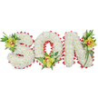 A tender, three-dimensional tribute spells the word 'SON' in large, sculpted letters made entirely from hundreds of small, pristine white chrysanthemum blooms. Each petal nestles tightly against its neighbour, creating a soft, cloud-like surface that reads as purity and quiet devotion when viewed against the plain white background. The perimeter of every letter is traced with a vivid red ribbon, artfully folded into a scalloped loop that peeks out like a satin frame; the red provides a deliberate, poignant contrast to the snowy chrysanthemums and quietly suggests love and remembrance. Set into the curves and hollows are three lime-green Cymbidium orchids - one tucked into the upper left of the 'S', another resting at the base of the 'O', and a third placed near the upper right of the 'N' - each orchid showing a delicate reddish-brown marking in its throat. Around these orchids a variety of glossy green leaves and fine fern fronds trail and curl, adding height, texture and a calming, natural rhythm to the design.
Soft, even lighting highlights the waxy sheen of the orchids and the velvety, tactile quality of the chrysanthemum heads without strong shadows, conveying a respectful stillness appropriate for a funeral or graveside memorial. As a Queensbury-based florist might explain when arranging a commemorative piece for families near Queensbury Station or the neighbouring Kingsbury and Canons Park, the combination of crisp white flowers, bold red edging and cool green orchids reads as both solemn and lovingly personal - a quiet, handcrafted expression of grief, memory and enduring affection that is easily understood even from a distance.